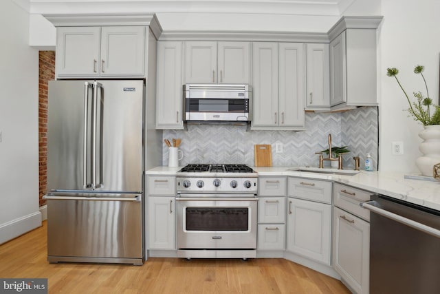408 M St NW Unit 4, Washington, DC 20001 - kitchen with high quality appliances, light wood-style flooring, light stone counters, and tasteful backsplash