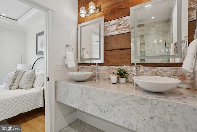 408 M St NW Unit 4, Washington, DC 20001 - bathroom featuring backsplash, a stall shower, double vanity, recessed lighting, and wood finished floors