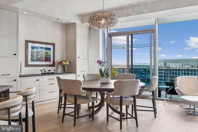 1881 N Nash St Unit 2309, Arlington, VA 22209 - dining space with light wood-style flooring, recessed lighting, and a chandelier