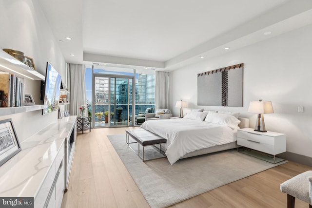 1881 N Nash St Unit 2309, Arlington, VA 22209 - bedroom featuring light wood-style floors, recessed lighting, and expansive windows