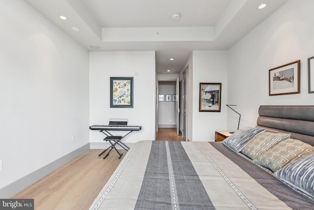 1881 N Nash St Unit 2309, Arlington, VA 22209 - bedroom with wood finished floors, recessed lighting, a tray ceiling, and baseboards