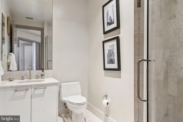 1881 N Nash St Unit 2309, Arlington, VA 22209 - bathroom featuring vanity, toilet, and a shower stall
