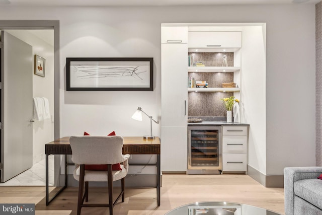 1881 N Nash St Unit 2309, Arlington, VA 22209 - indoor bar with wine cooler, light wood-type flooring, and baseboards
