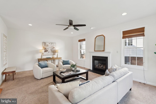 42322 Rising Moon Pl, Brambleton, VA 20148 - carpeted living area with recessed lighting, ceiling fan, baseboards, and a fireplace with flush hearth