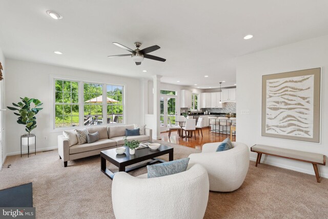42322 Rising Moon Pl, Brambleton, VA 20148 - living area with plenty of natural light, ceiling fan, recessed lighting, and light carpet