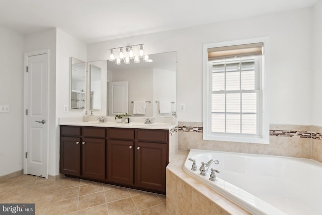 42322 Rising Moon Pl, Brambleton, VA 20148 - bathroom featuring double vanity, a bath, tile patterned floors, and a chandelier