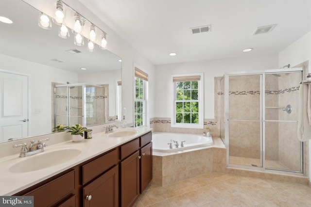 42322 Rising Moon Pl, Brambleton, VA 20148 - bathroom with tile patterned flooring, double vanity, a shower stall, a bath, and recessed lighting