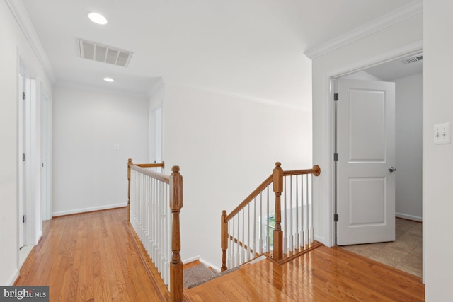 42322 Rising Moon Pl, Brambleton, VA 20148 - hall featuring an upstairs landing, wood finished floors, crown molding, recessed lighting, and baseboards
