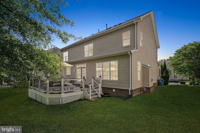 42322 Rising Moon Pl, Brambleton, VA 20148 - back of property featuring a lawn, a deck, and crawl space