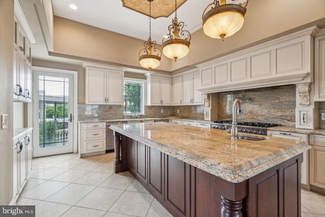 3135 S Uber St, Philadelphia, PA 19145 - kitchen featuring stainless steel dishwasher, decorative backsplash, and light tile patterned flooring
