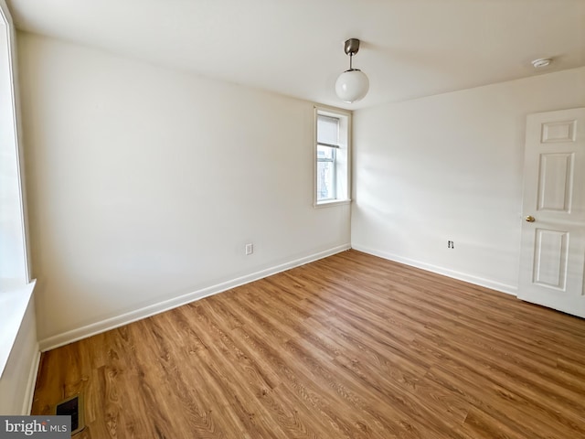 2426 Jefferson St, Baltimore, MD 21205 - spare room featuring wood finished floors, a smoke detector, and baseboards