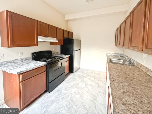 2426 Jefferson St, Baltimore, MD 21205 - kitchen with black range with electric stovetop, a sink, light countertops, under cabinet range hood, and freestanding refrigerator