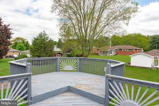 691 Harvey St, West Hazleton, PA 18202 - wooden deck with a shed, a lawn, and an outdoor structure