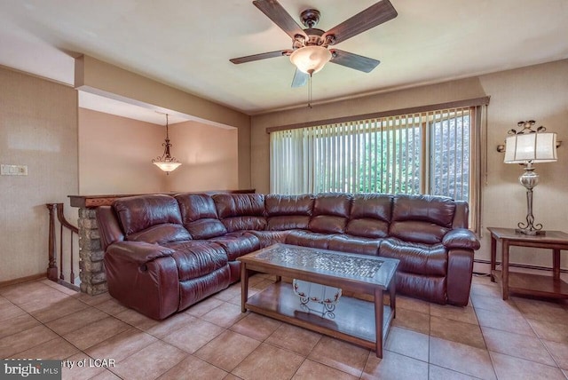 691 Harvey St, West Hazleton, PA 18202 - living room featuring ceiling fan, light tile patterned floors, a baseboard heating unit, and baseboards