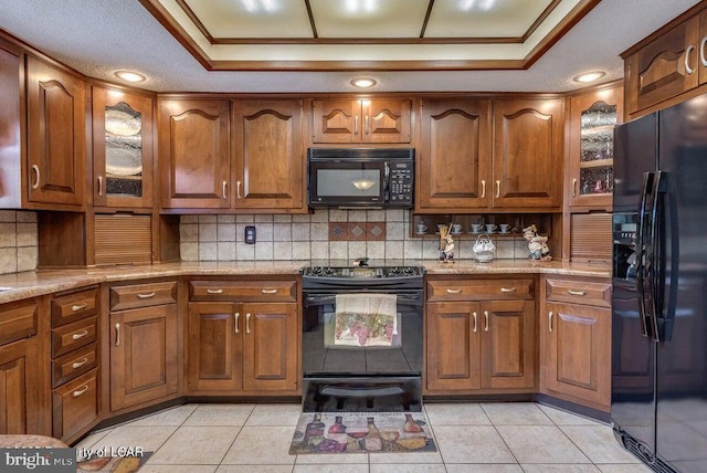 691 Harvey St, West Hazleton, PA 18202 - kitchen with black appliances, a raised ceiling, decorative backsplash, light tile patterned flooring, and ornamental molding