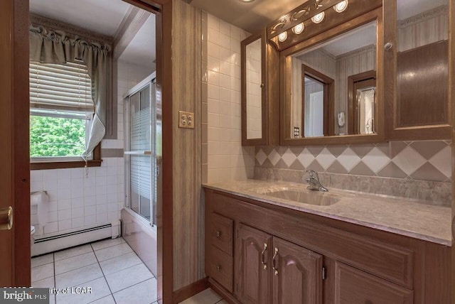 691 Harvey St, West Hazleton, PA 18202 - full bathroom with a baseboard heating unit, tile patterned floors, vanity, bath / shower combo with glass door, and tasteful backsplash