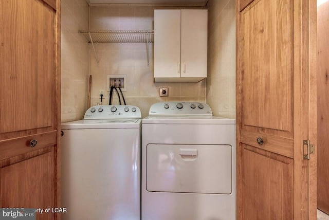 691 Harvey St, West Hazleton, PA 18202 - clothes washing area featuring washer and clothes dryer and cabinet space