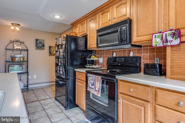 691 Harvey St, West Hazleton, PA 18202 - kitchen with black appliances, light countertops, light tile patterned floors, decorative backsplash, and baseboards