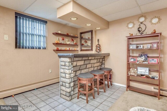 691 Harvey St, West Hazleton, PA 18202 - indoor dry bar with tile patterned flooring, a baseboard heating unit, a drop ceiling, and baseboards