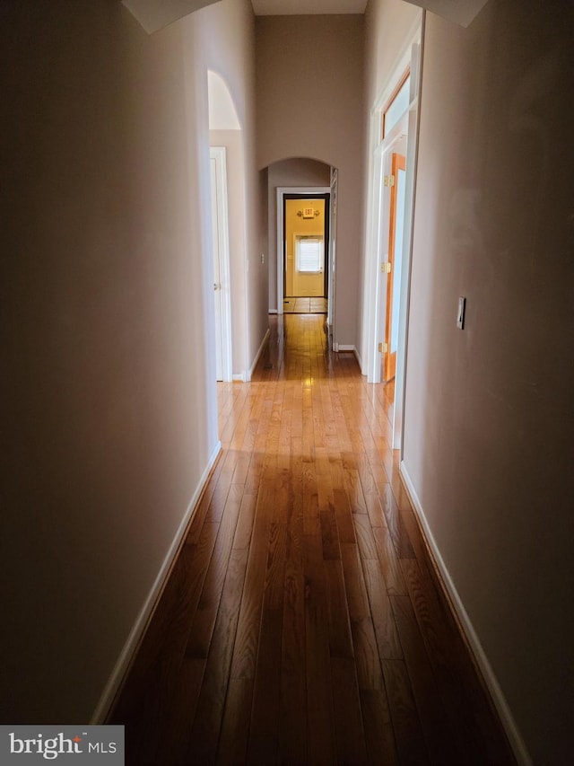 364 Swedesboro Rd, Mullica Hill, NJ 08062 - hallway featuring arched walkways, dark wood-style flooring, and baseboards