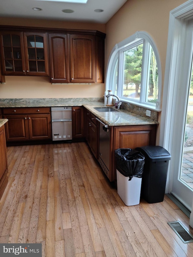364 Swedesboro Rd, Mullica Hill, NJ 08062 - kitchen with a sink, light wood-style floors, glass insert cabinets, and dishwasher