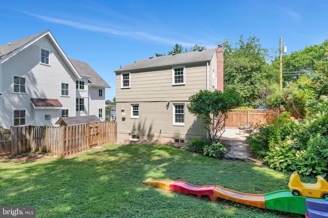970 N Longfellow St, Arlington, VA 22205 - rear view of house with a chimney