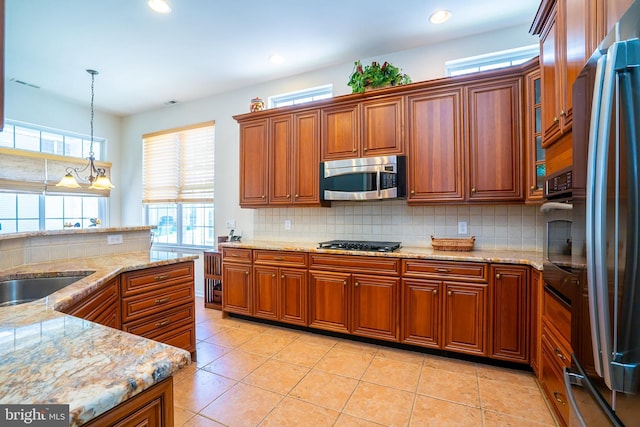 6 Galileo Dr, Cranbury, NJ 08512 - kitchen with stainless steel appliances, healthy amount of natural light, brown cabinets, backsplash, and recessed lighting