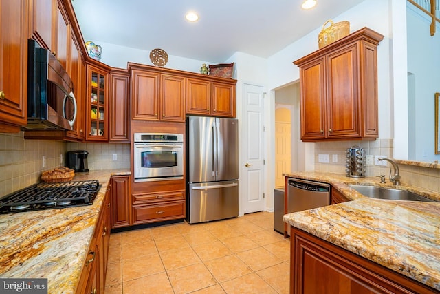 6 Galileo Dr, Cranbury, NJ 08512 - kitchen with stainless steel appliances, a sink, decorative backsplash, light stone countertops, and recessed lighting