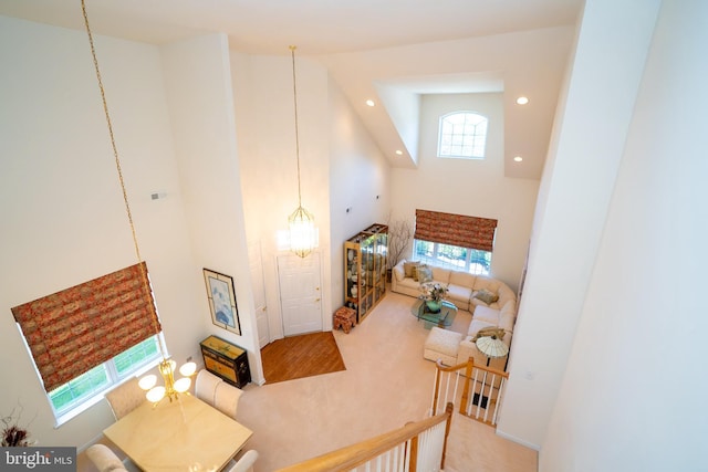 6 Galileo Dr, Cranbury, NJ 08512 - living area featuring a towering ceiling, carpet, recessed lighting, and a chandelier