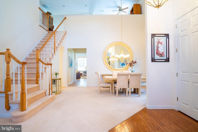 6 Galileo Dr, Cranbury, NJ 08512 - foyer featuring a chandelier, stairway, a high ceiling, ceiling fan, and baseboards