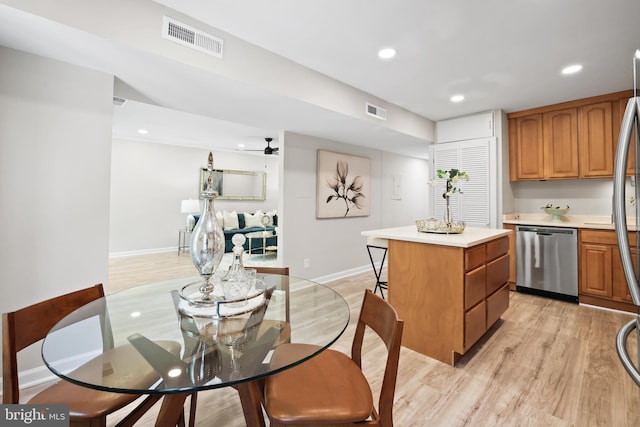 5050 7th Rd S Unit 201, Arlington, VA 22204 - kitchen with appliances with stainless steel finishes, a kitchen island, light countertops, light wood-type flooring, and recessed lighting