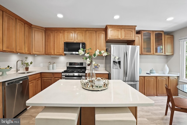 5050 7th Rd S Unit 201, Arlington, VA 22204 - kitchen with appliances with stainless steel finishes, a sink, light countertops, light wood-style floors, and recessed lighting