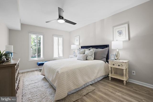 5050 7th Rd S Unit 201, Arlington, VA 22204 - bedroom with baseboards, light wood-style flooring, and ceiling fan