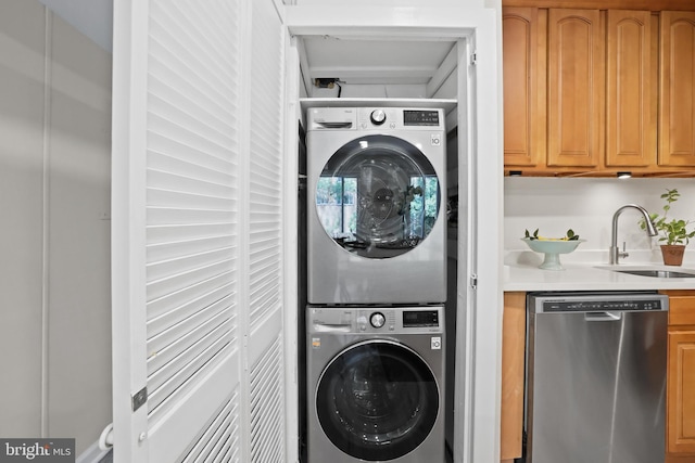 5050 7th Rd S Unit 201, Arlington, VA 22204 - laundry room featuring stacked washer / drying machine and a sink