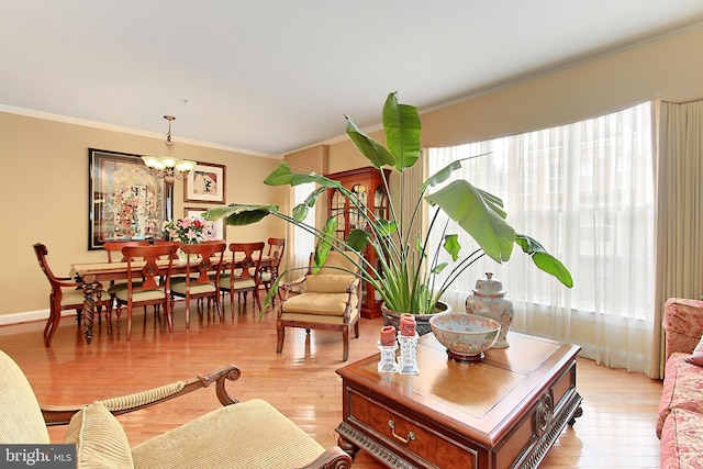 120 Fortnightly Blvd, Herndon, VA 20170 - living room with crown molding, healthy amount of natural light, light wood finished floors, and a chandelier