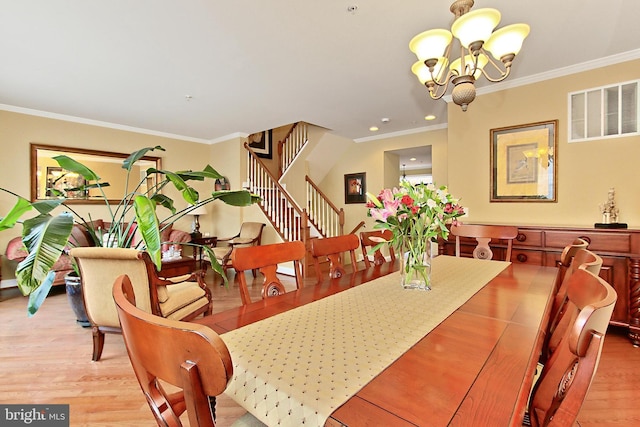 120 Fortnightly Blvd, Herndon, VA 20170 - dining area with stairway, a chandelier, wood finished floors, crown molding, and recessed lighting