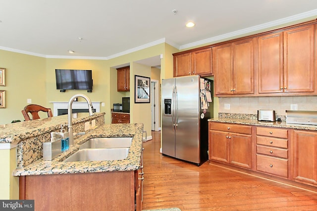 120 Fortnightly Blvd, Herndon, VA 20170 - kitchen with stainless steel fridge with ice dispenser, a sink, light wood-style floors, ornamental molding, and light stone counters