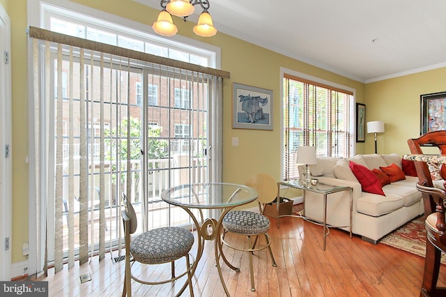 120 Fortnightly Blvd, Herndon, VA 20170 - dining space with crown molding, wood-type flooring, and a chandelier