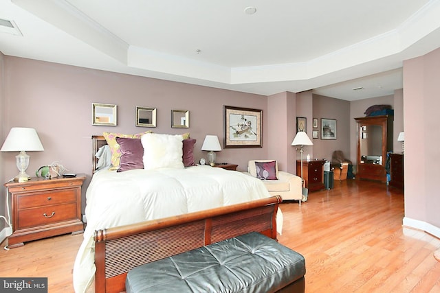 120 Fortnightly Blvd, Herndon, VA 20170 - bedroom with a raised ceiling, light wood-style flooring, and crown molding