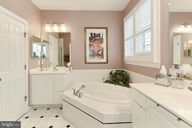 120 Fortnightly Blvd, Herndon, VA 20170 - full bathroom with a bath, two vanities, and tile patterned floors