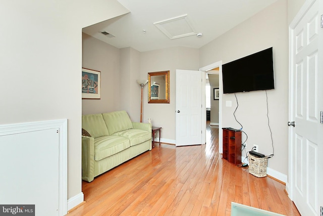 120 Fortnightly Blvd, Herndon, VA 20170 - living area with attic access, light wood-type flooring, and baseboards
