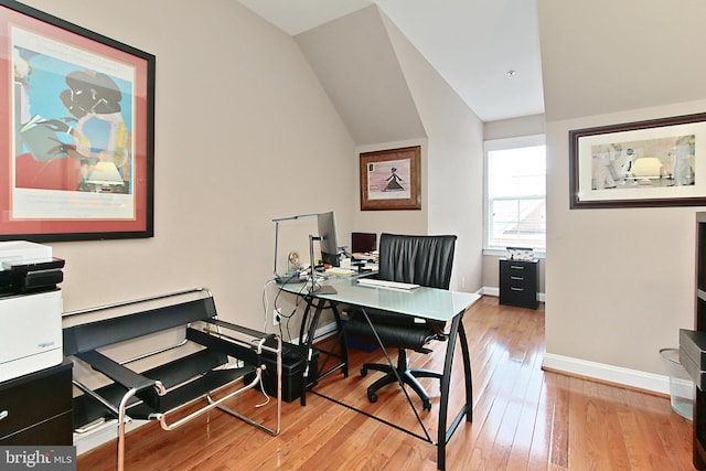 120 Fortnightly Blvd, Herndon, VA 20170 - home office featuring wood-type flooring, lofted ceiling, and baseboards