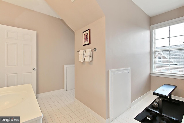 120 Fortnightly Blvd, Herndon, VA 20170 - bathroom featuring vaulted ceiling, baseboards, tile patterned flooring, and vanity