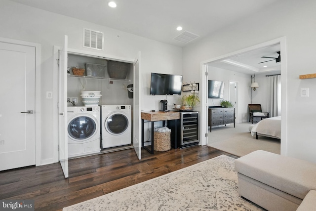 washroom with separate washer and dryer, wine cooler, wood finished floors, recessed lighting, and ceiling fan