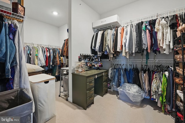 walk in closet with carpet
