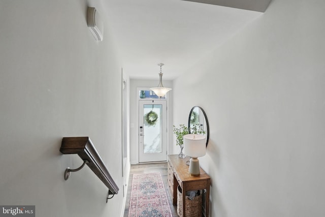 foyer featuring wood finished floors