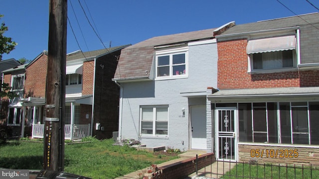 5732 5th St NE, Washington, DC 20011 - multi unit property with brick siding, a sunroom, and a front yard