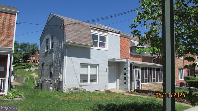5732 5th St NE, Washington, DC 20011 - multi unit property with brick siding, cooling unit, and a sunroom