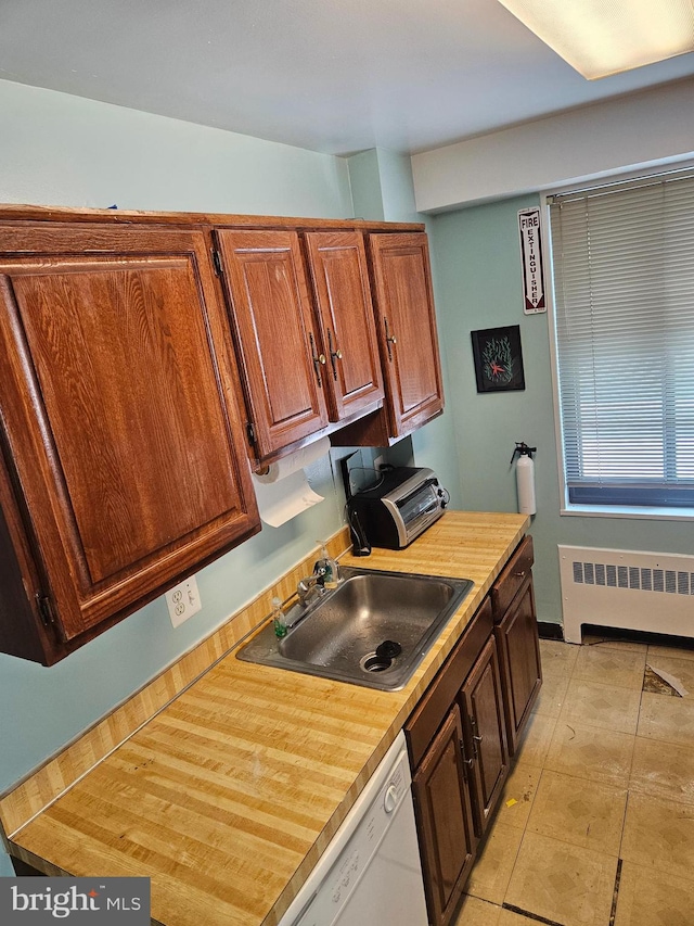 5410 Connecticut Ave NW Unit 112, Washington, DC 20015 - kitchen with radiator heating unit, a sink, and dishwasher