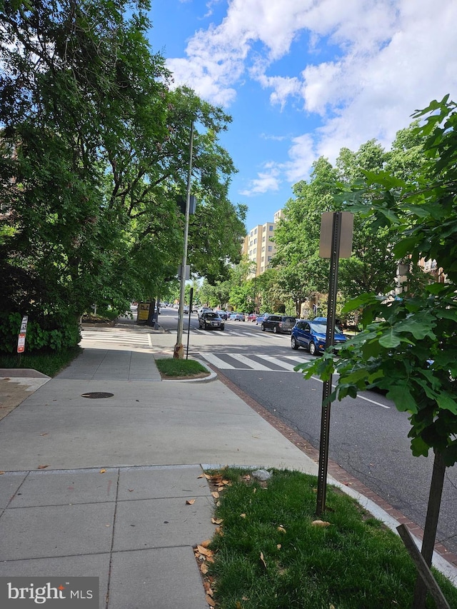 5410 Connecticut Ave NW Unit 112, Washington, DC 20015 - view of asphalt street with sidewalks, traffic signs, curbs, and street lighting